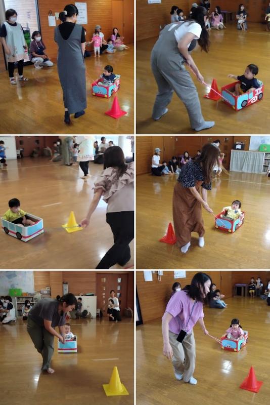 くるまに乗った子を引っ張る写真