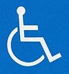 障害者のための国際シンボルマークの画像。車椅子に人が乗っているような画像